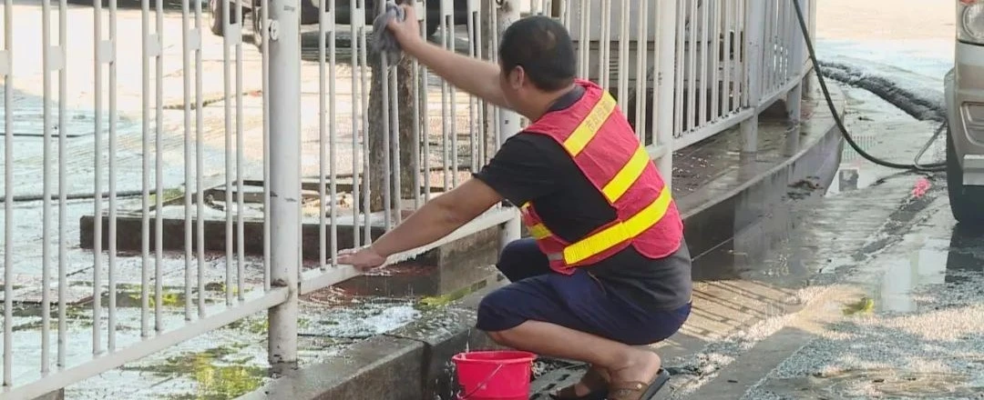 Person cleaning white vinyl PVC railing with a damp cloth and mild soap solution demonstrating the simple low-effort maintenance routine that keeps vinyl railings looking clean without sanding painting or chemical treatments required by wood and metal alternatives